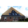 Nieuwe spiegel en onderhoud dak door rietdekkersbedrijf Kooijman.